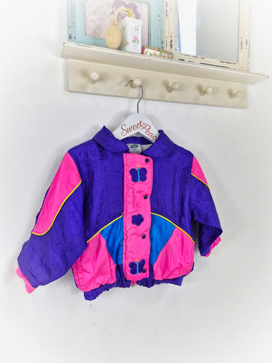 18 months. Purple and hot pink wind breaker with butterflies from Cuties by Judy