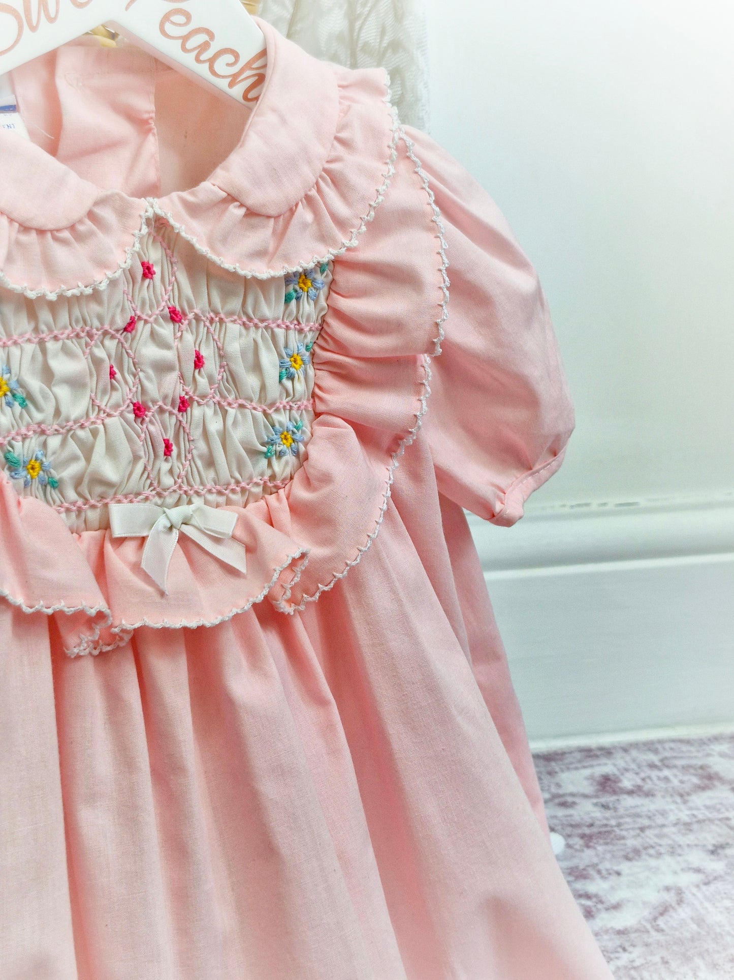 18-24 months. Pink Polly Flinders smock dress with ruffles