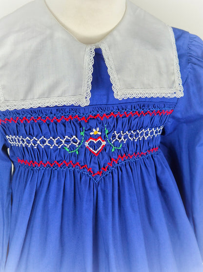 5-6 years. Royal blue vintage smock dress with embroidered heart and red design & white detachable collar. Princess Anne