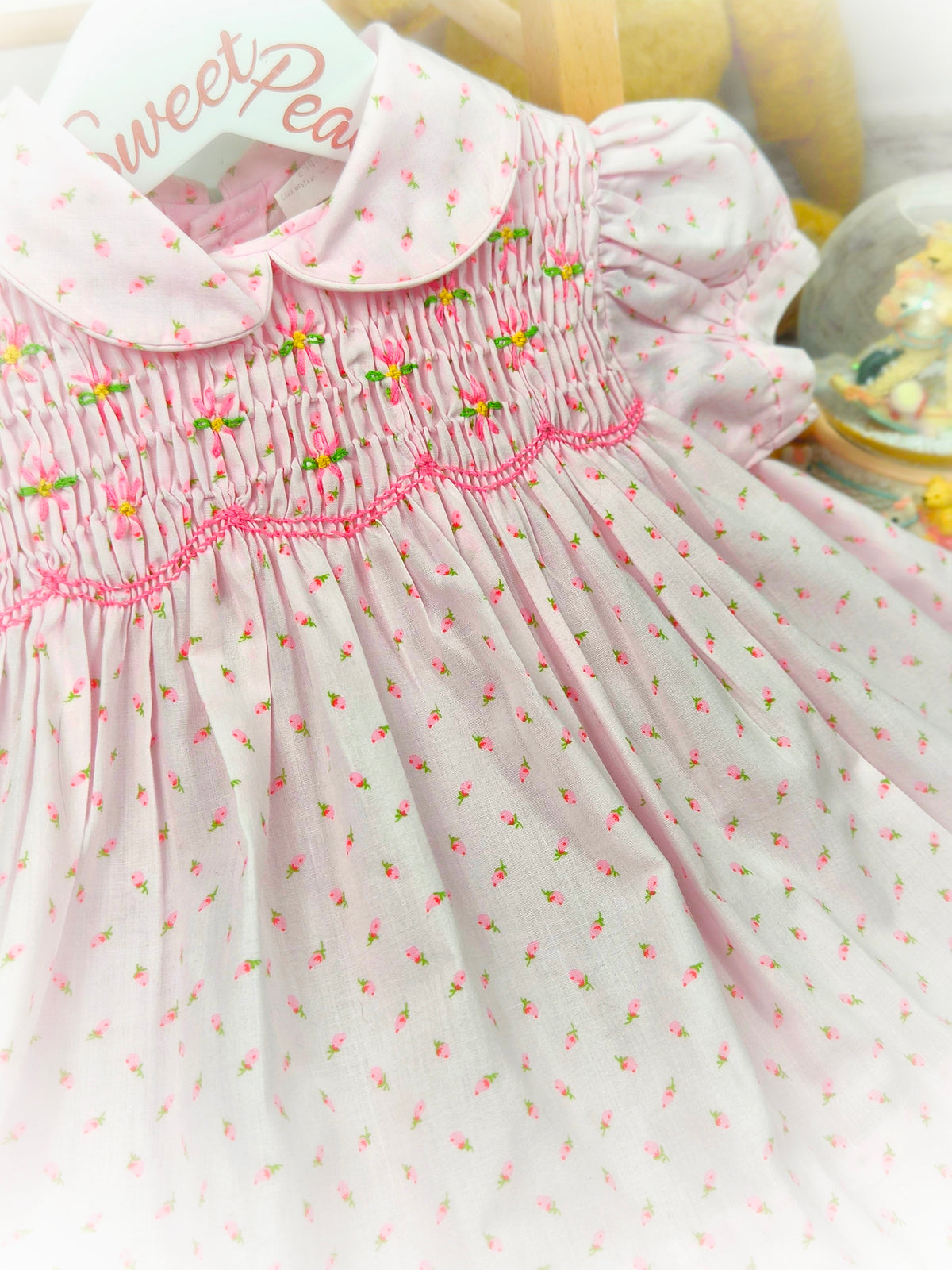 9-12 months. Pink vintage floral smock dress by Baby Togs with embroidered flowers