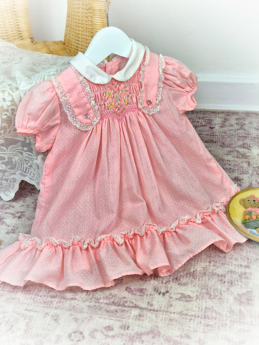 18-24 months. Pink vintage Polly Flinders smock dress wih white collar and polka dots