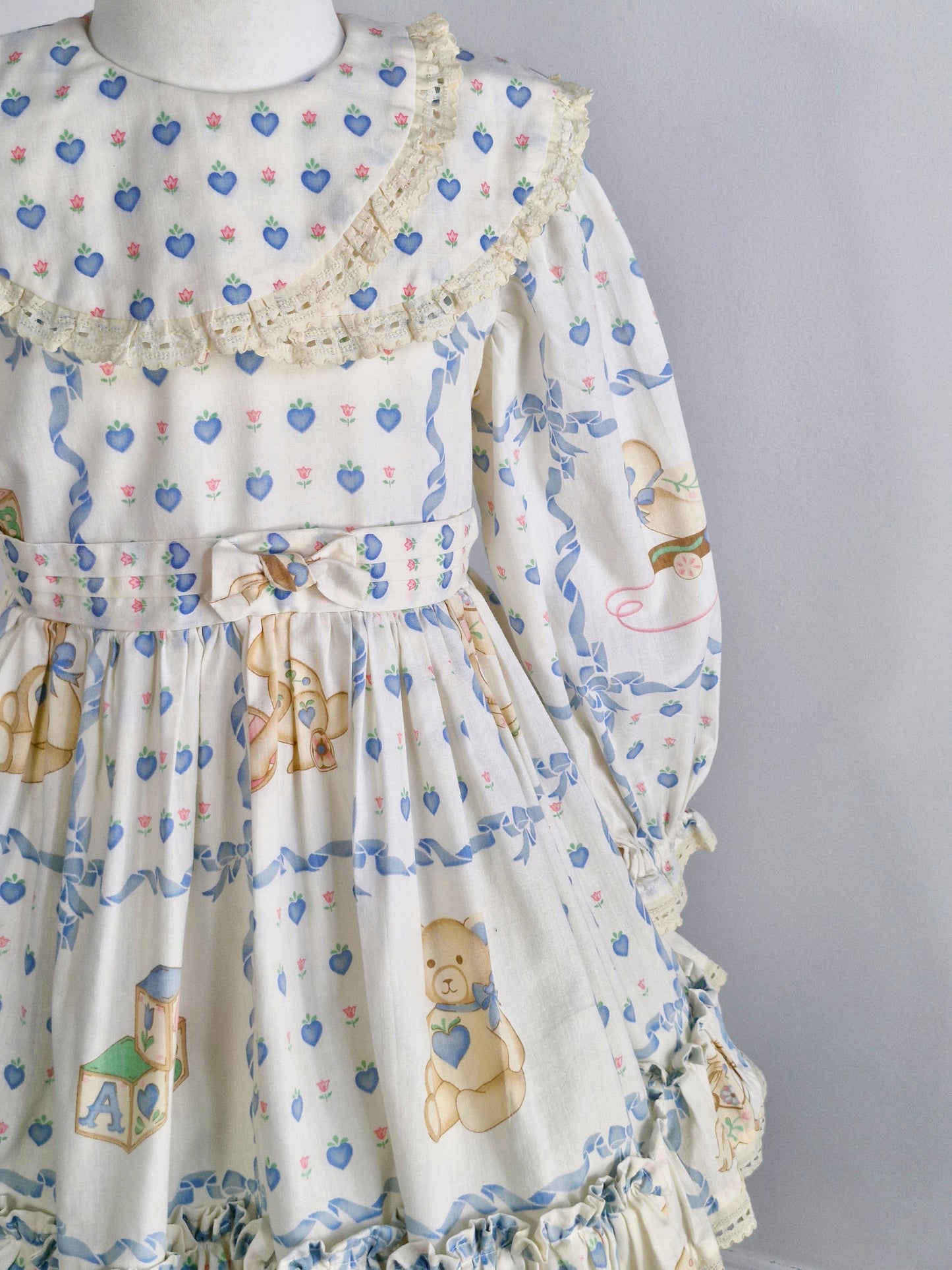 5 years. Vintage cream dress with sweet bears and bunnies and blue hearts and flowers