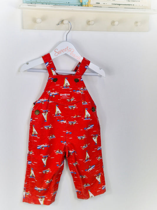 Best fit 6-12 months. Red Oshkosh dungarees with bears