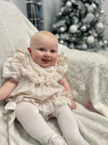 6-9 months. White frilly dress with pink polka dots