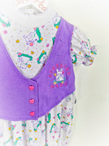 18 months. Purple and white romper with rabbit prints and heart buttons