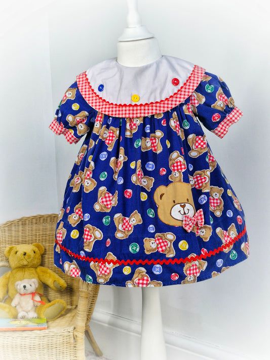 2-3 years. Vintage navy teddy dress with white bib and red gingham details. Mayfair Kids