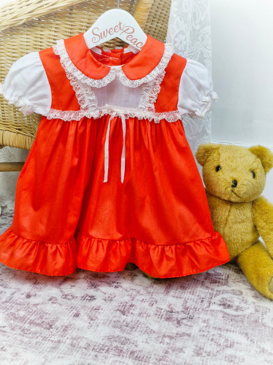 12-18 months. Red dress with white ribbon and lace. JC Penney
