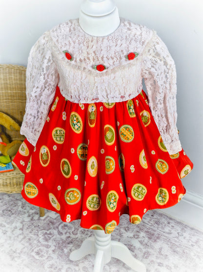 2-3 years. Vintage inspired dress, white lace top and sleeves with full circle red skirt featuring cute teddy bears