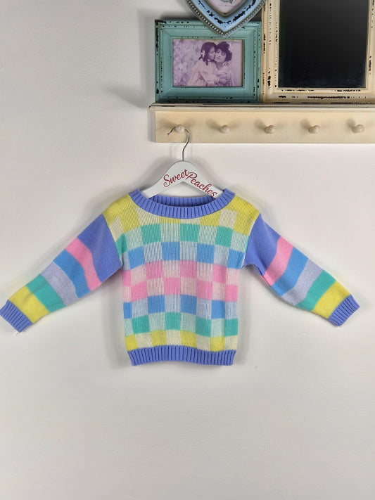 2 years. Mini Waves pastel checked and striped knit jumper
