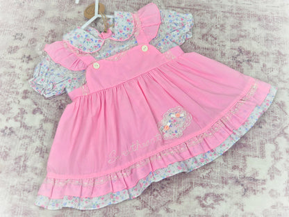 18 months. Pink vintage frilly dress with embroidered "sweetheart", frills and floral patterns