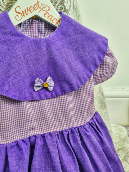 2 years. Purple gingham dress with bib. Handmade