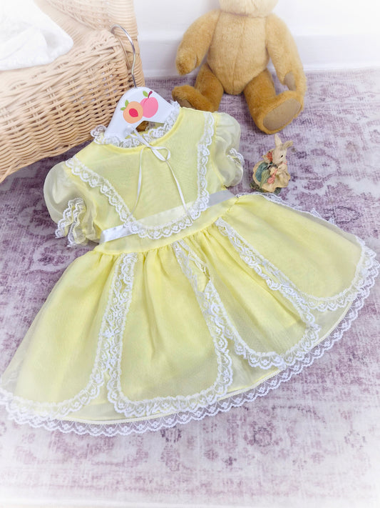 18-24 months. Lemon frilly vintage dress with white lace details by Star