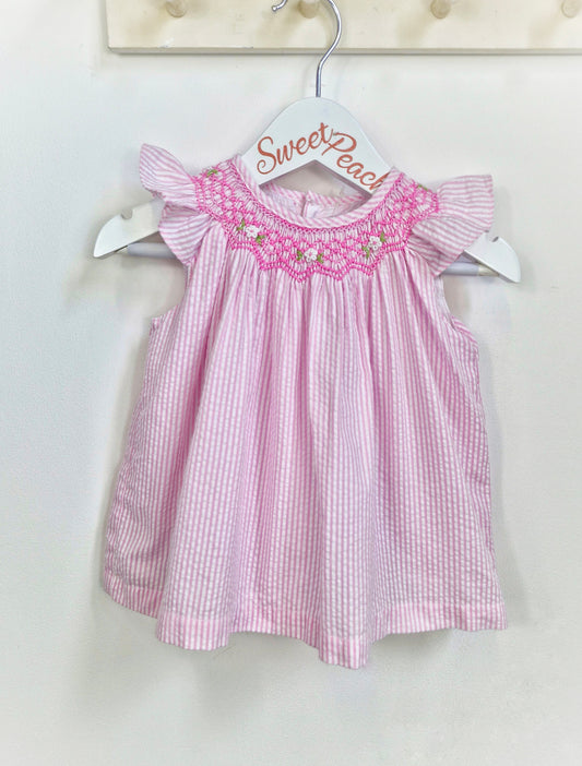9-12 months. Vintage inspired pink and white striped dress with pink smock collar and flutter sleeves