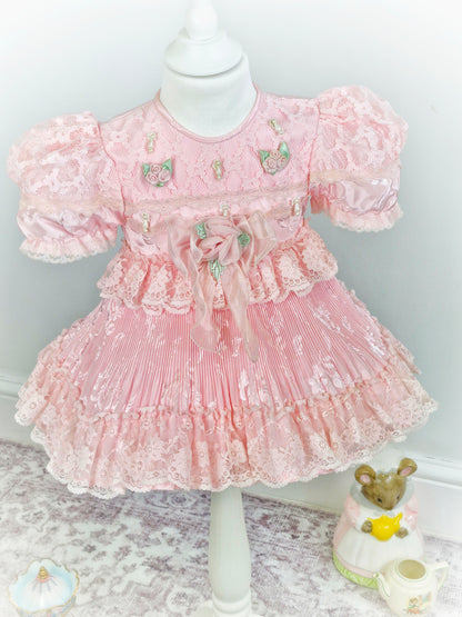 12-18 months. Pink frilly vintage dress with lots of details.
