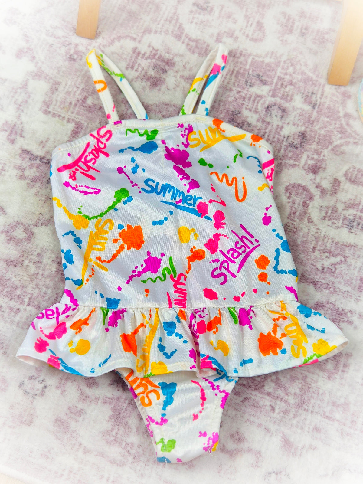 12-18 months. Swimming costume