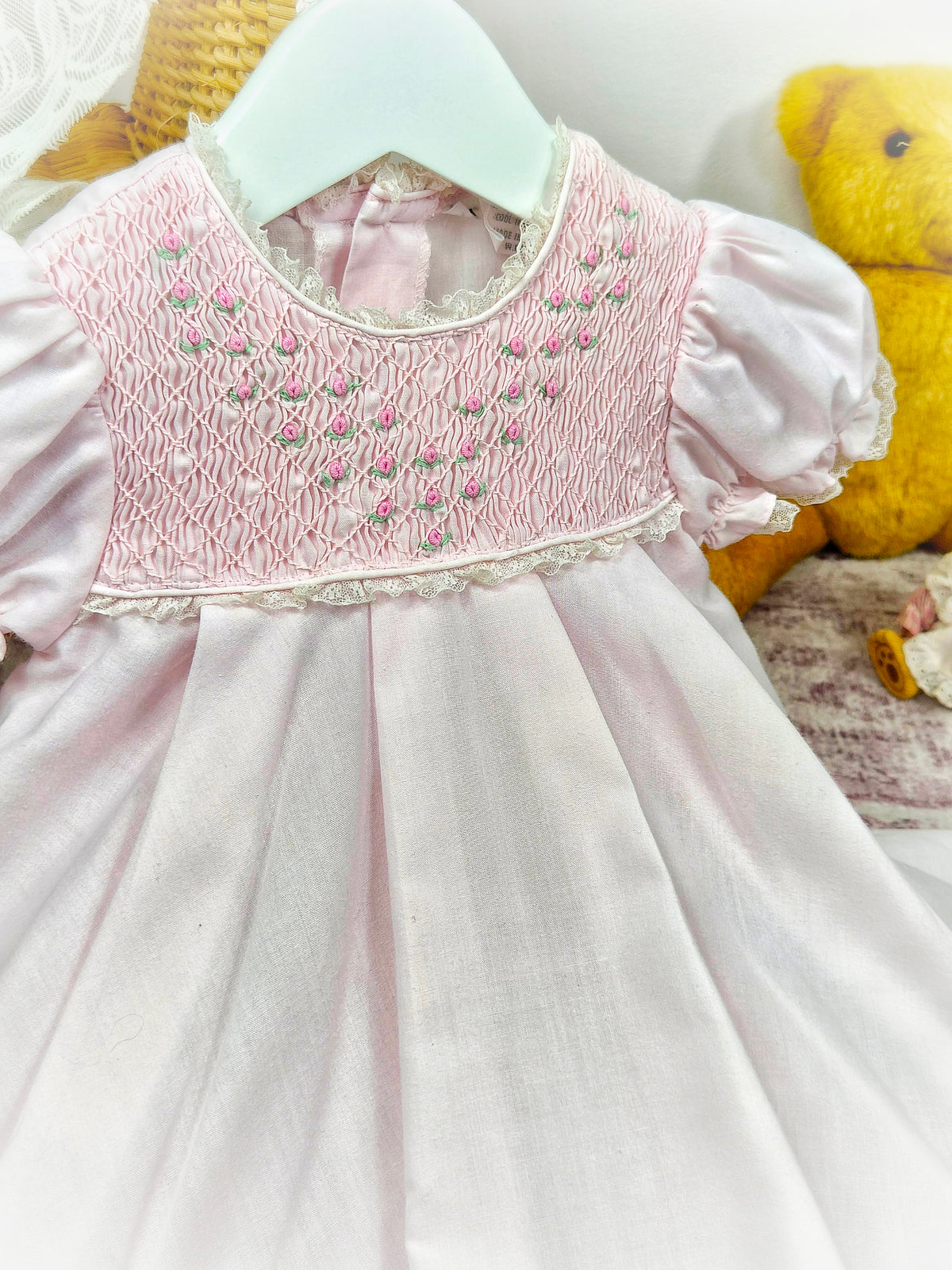 9-12 months. Pink vintage smock dress embroidered with dainty flowers. Small faults*