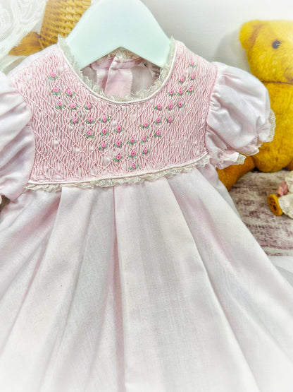 9-12 months. Pink vintage smock dress embroidered with dainty flowers. Small faults*