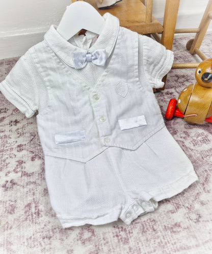 9-12 months. White one-piece romper, waistcoat and bow tie style