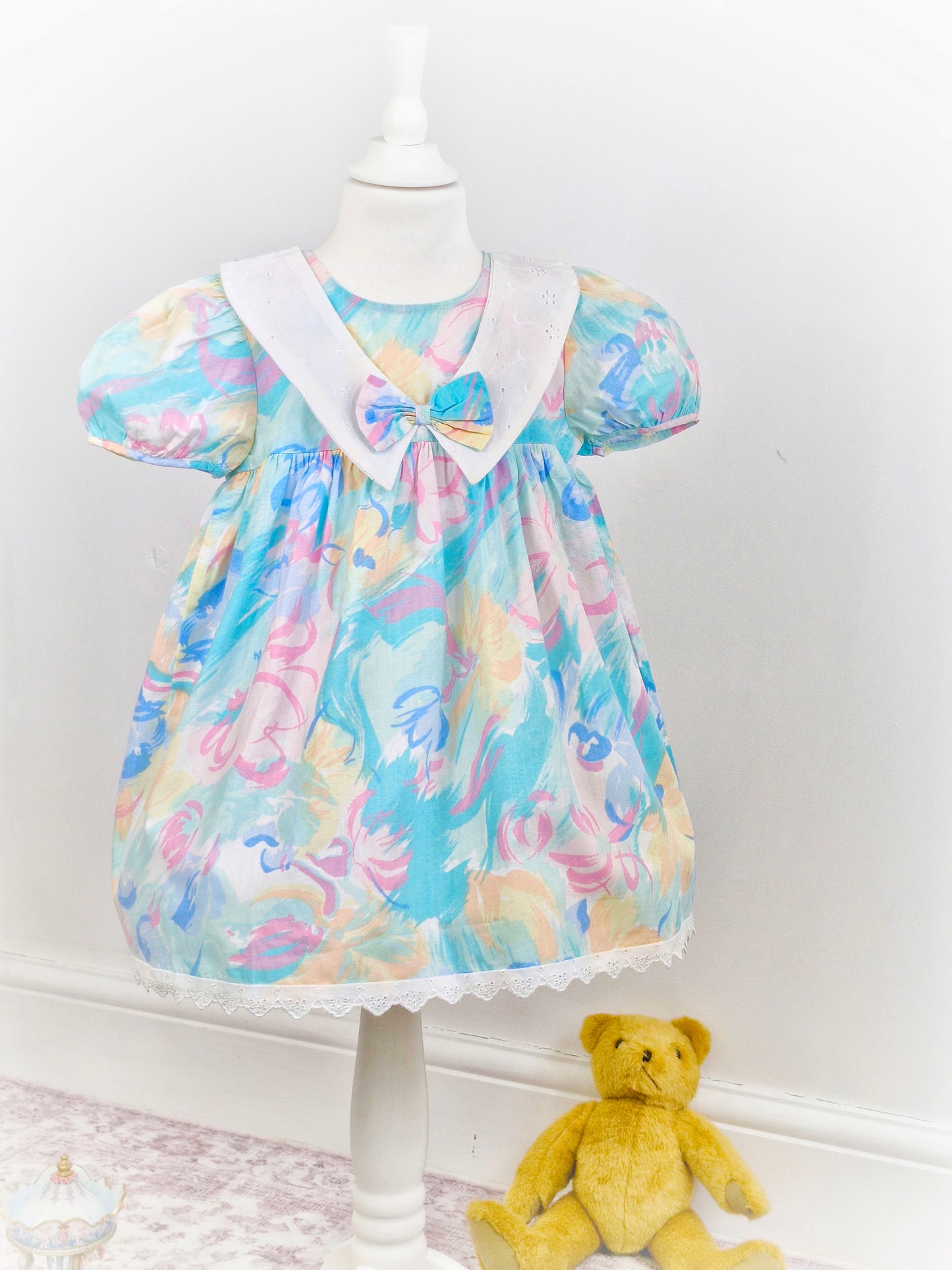 3-4 years. Funky vintage dress with white broderie anglais bib and hem