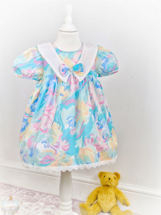 3-4 years. Funky vintage dress with white broderie anglais bib and hem