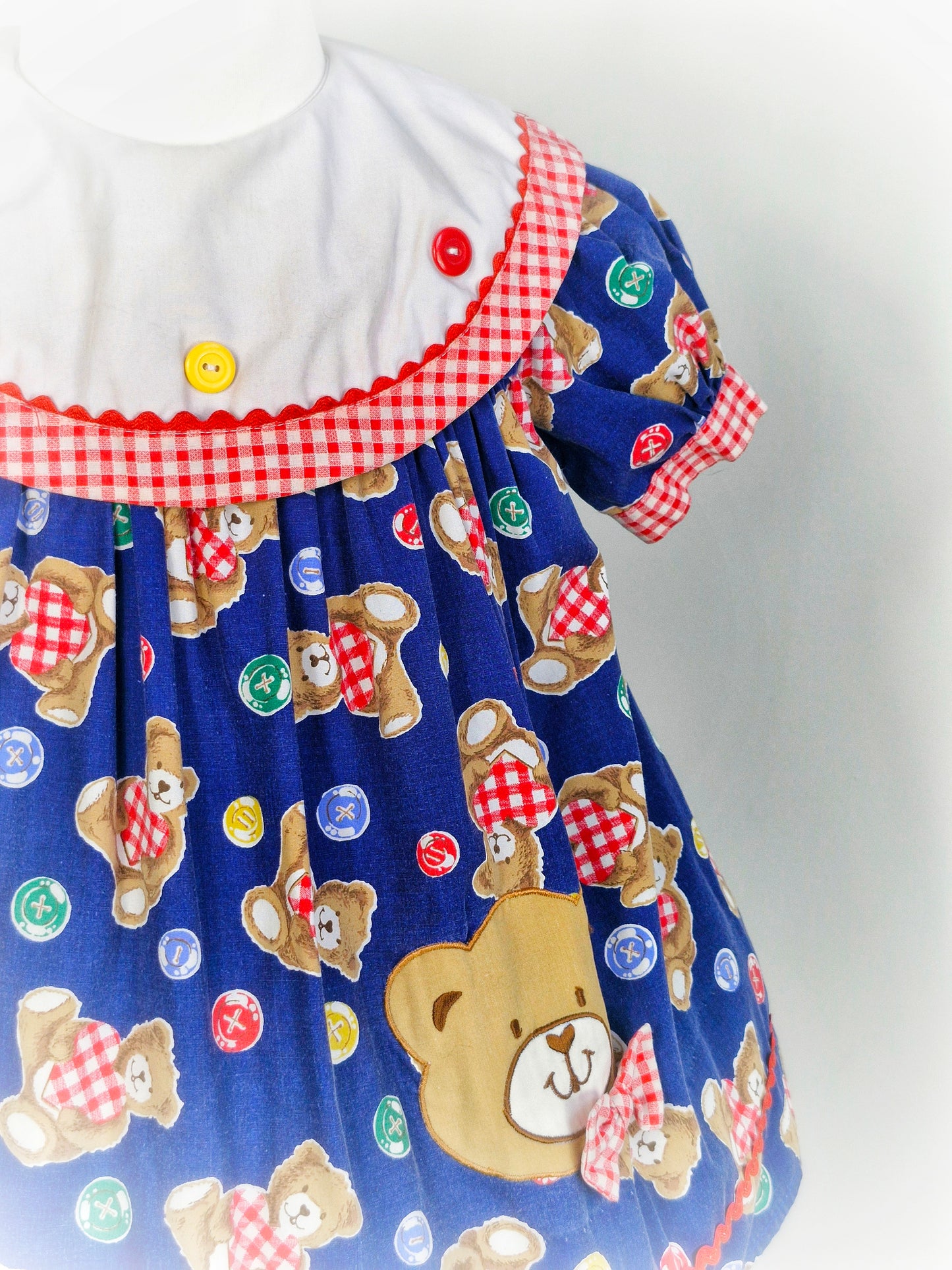 2-3 years. Vintage navy teddy dress with white bib and red gingham details. Mayfair Kids