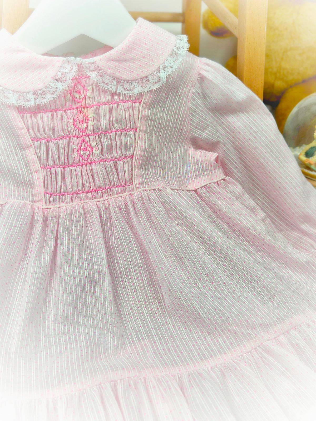 12-18 months. Pink vintage Polly Flinders smock dress with pink embroidery, stripes & spots and lace trim