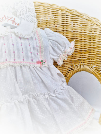 12 months. White Polly Flinders dress with pink smocking and ribbon details