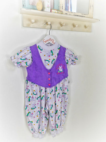 18 months. Purple and white romper with rabbit prints and heart buttons