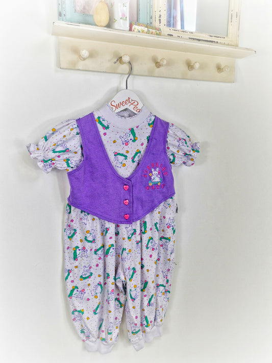 18 months. Purple and white romper with rabbit prints and heart buttons