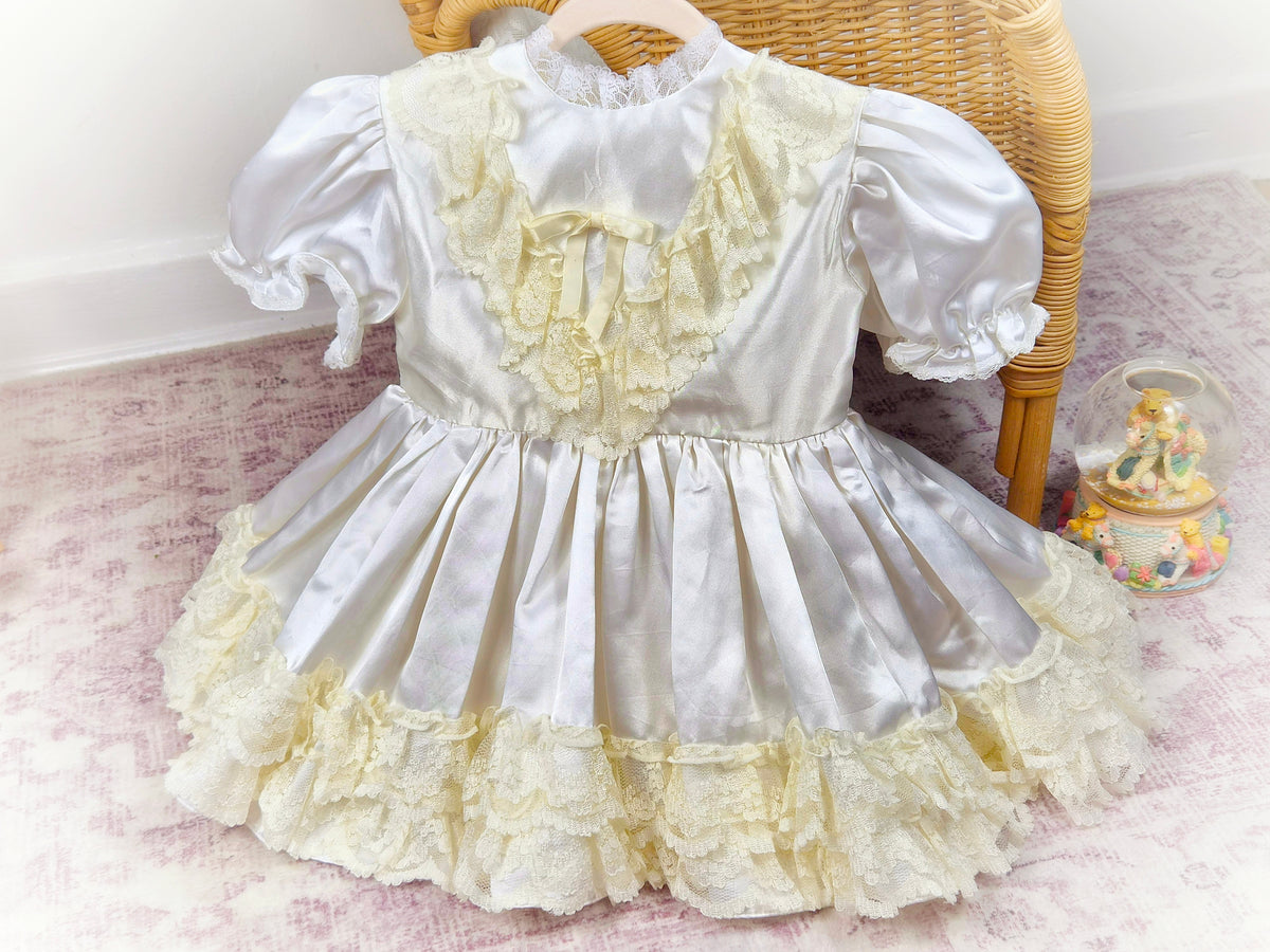 2 years. Satin vintage dress with lace layers and puff sleeves