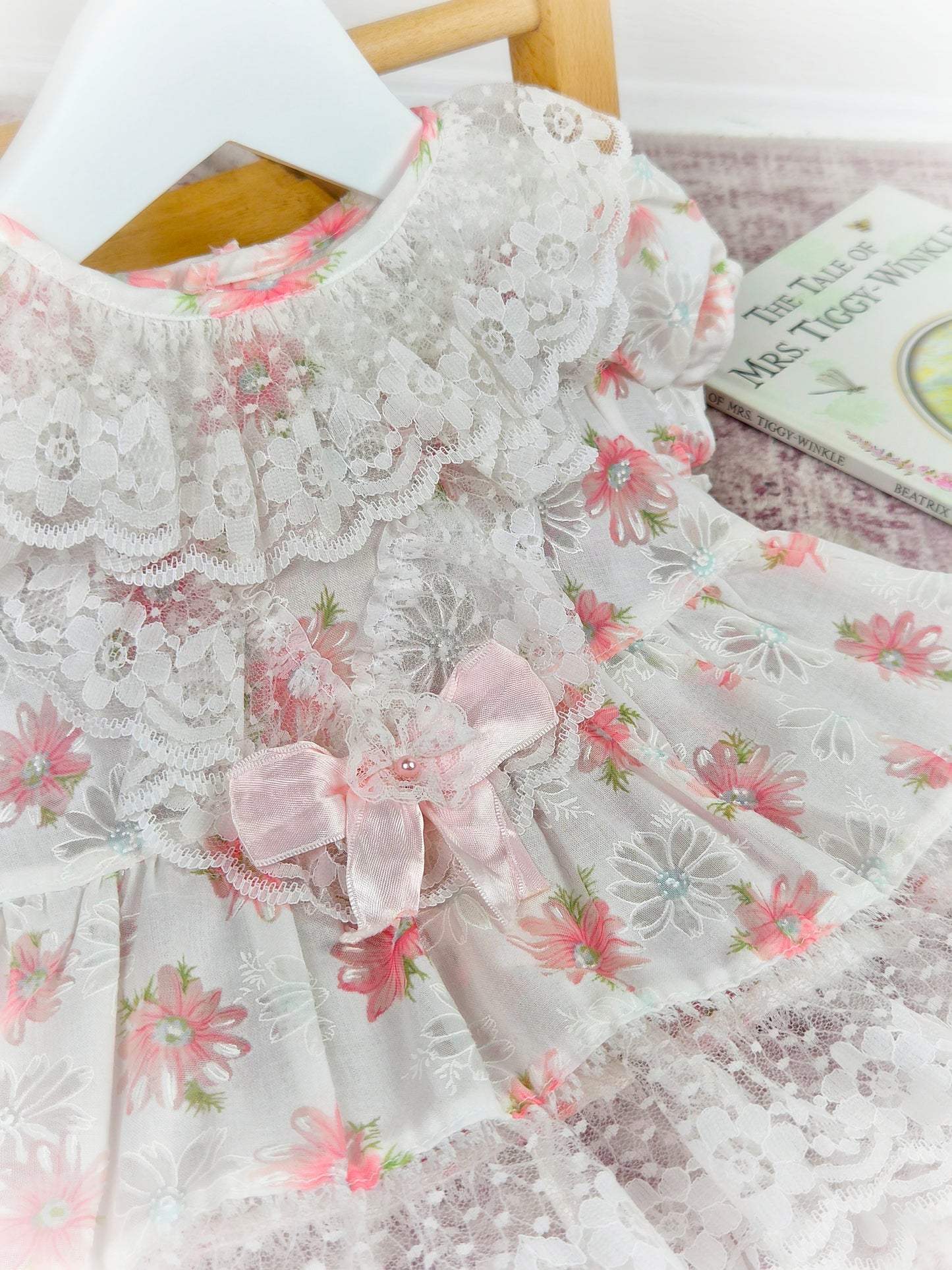3-6 months. Vintage white sheer dress wkth pink floral print, sating ribbon bow and lace ruffled neck and hem