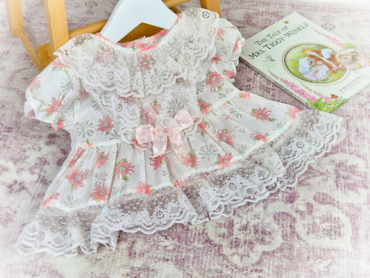3-6 months. Vintage white sheer dress wkth pink floral print, sating ribbon bow and lace ruffled neck and hem