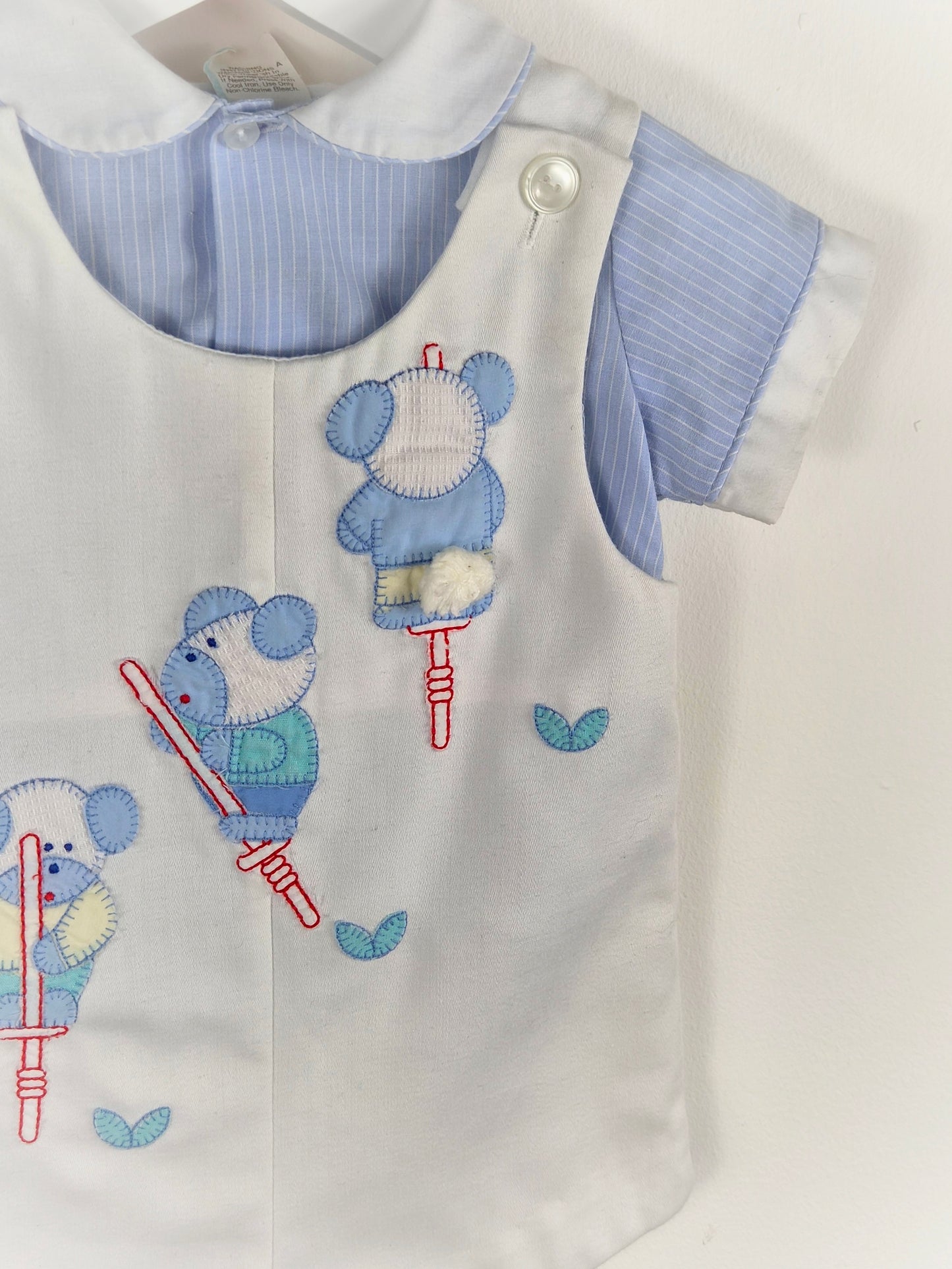 9-12 months. Two piece vintage set, blue shirt and white, short overalls