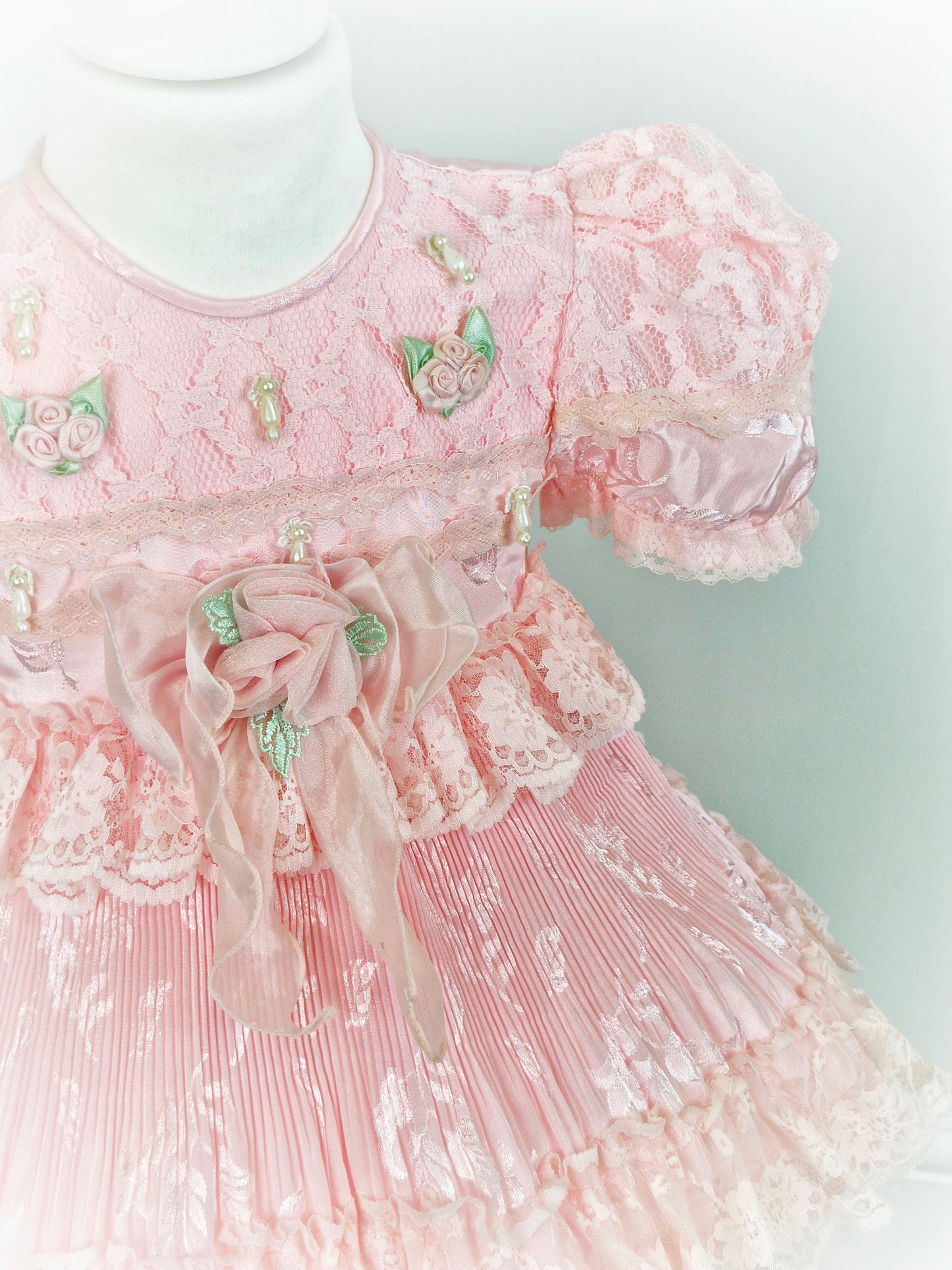 12-18 months. Pink frilly vintage dress with lots of details.