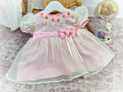 9-12 months. Pink striped vintage taffeta dress with lace collar, pink flowers and belt.