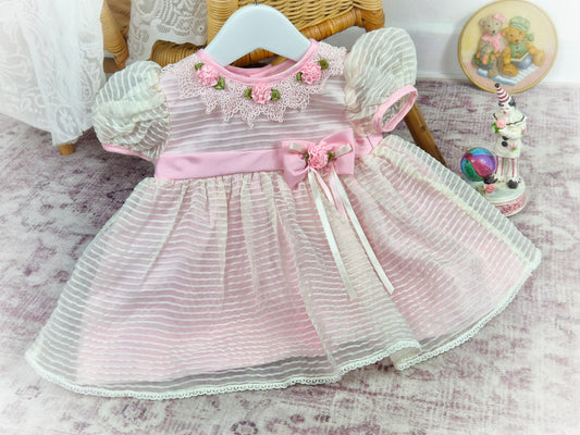 9-12 months. Pink striped vintage taffeta dress with lace collar, pink flowers and belt.