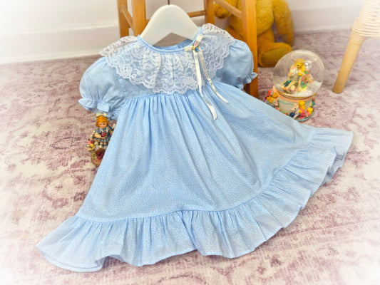 12 months. Blue vintage dress by Cutest One with dainty floral patterns and white lace collar