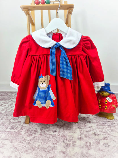 18-24 months. Red vintage Samara dress with navy polka dot neck tie, white collar and teddy bear applique