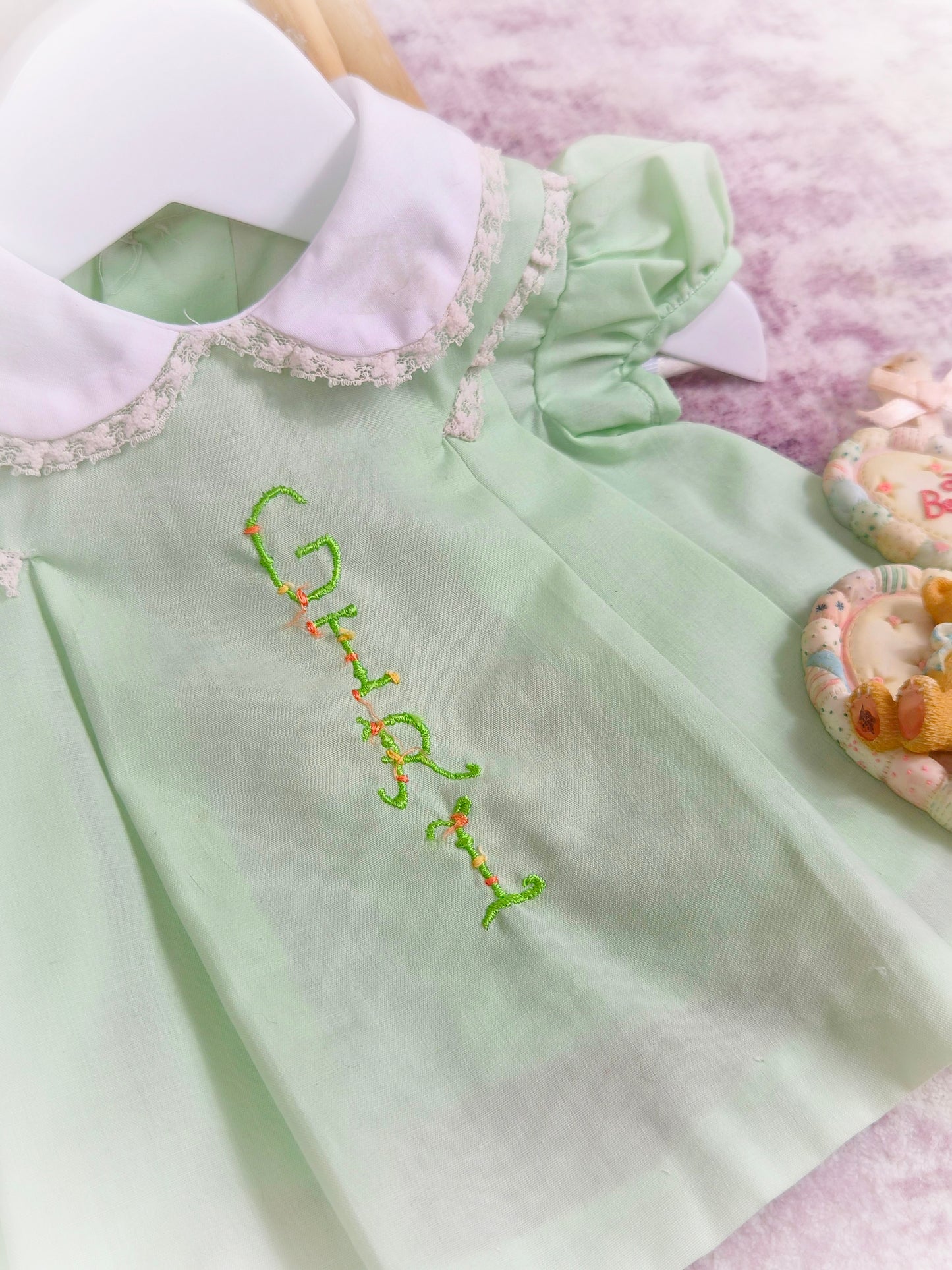 0-3 months. Mint vintage dress with puff sleeves, white collar and embroidered "Girl"