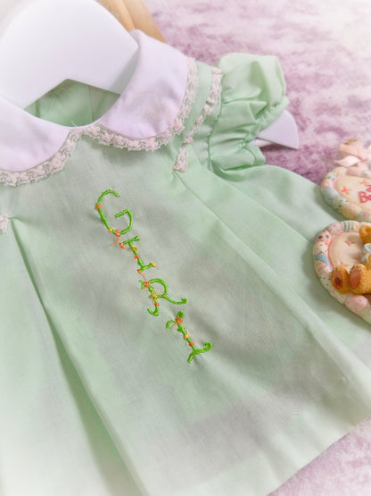 0-3 months. Mint vintage dress with puff sleeves, white collar and embroidered "Girl"