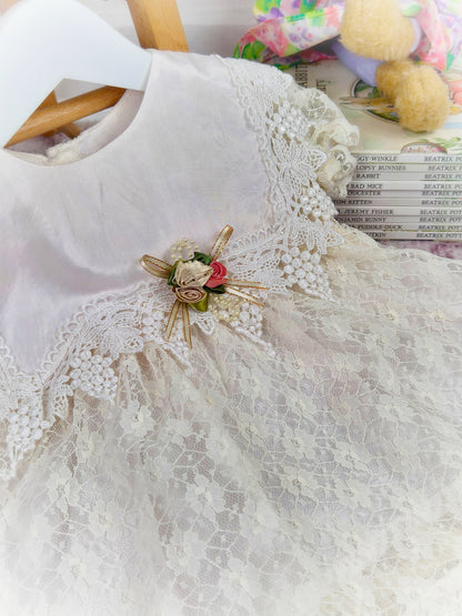 12-18 months. Cream lace vintage dress with beautiful bib trim and floral centre