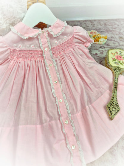 12-18 months. Vintage pink smock dress, embroidered by hand.