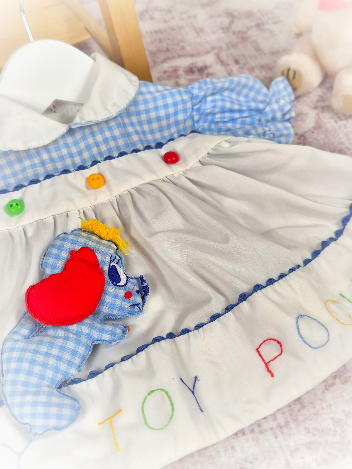 0-3 months. Vintage dress with embroidered "My Toy Pocket", stuffed dog toy and little button details