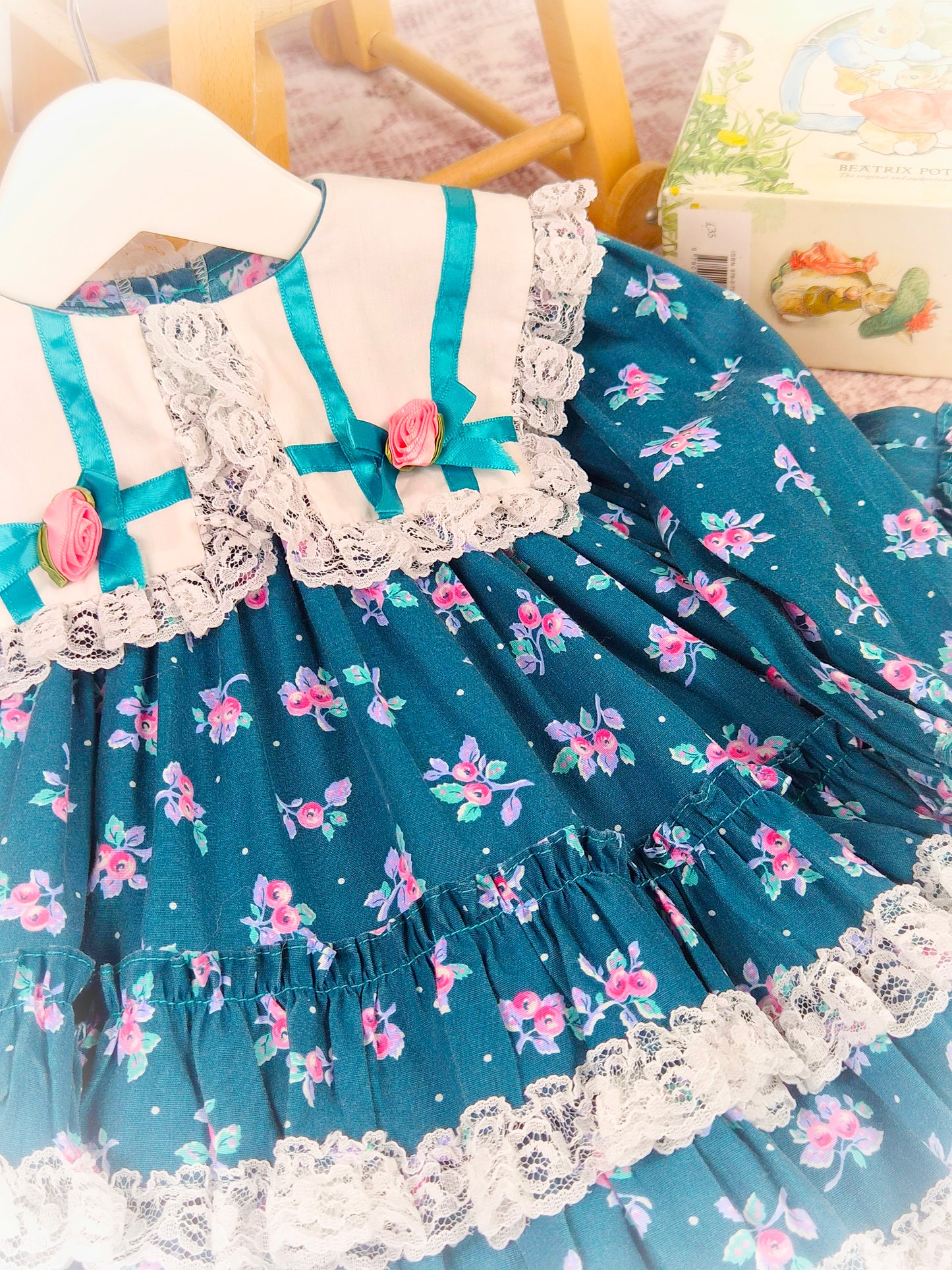 12 months. Teal floral vintage dress with white collar, lace trim, ribbon bows and rosettes