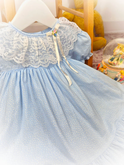 12 months. Blue vintage dress by Cutest One with dainty floral patterns and white lace collar