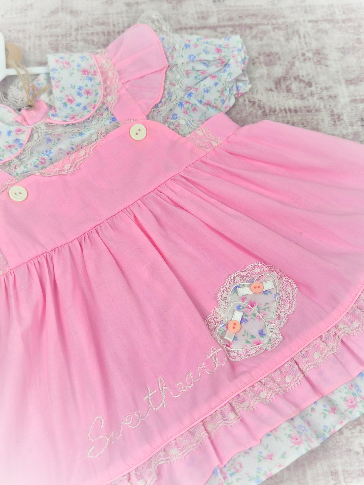 18 months. Pink vintage frilly dress with embroidered "sweetheart", frills and floral patterns