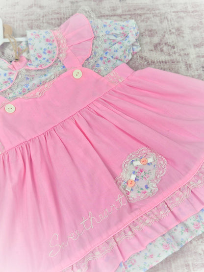 18 months. Pink vintage frilly dress with embroidered "sweetheart", frills and floral patterns