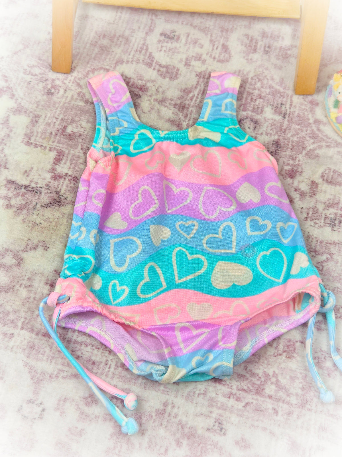 12-18 months. Swimming costume