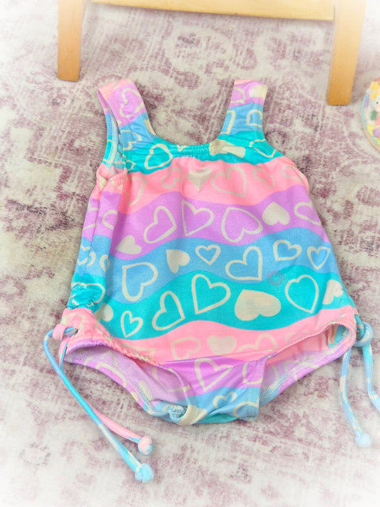 12-18 months. Swimming costume