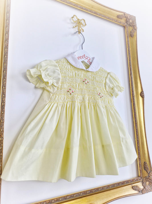 9-12 months. Lemon smock dress with pink embroidered flowers and white collar